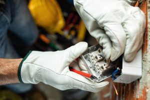 Electrician at work on a residential electrical system